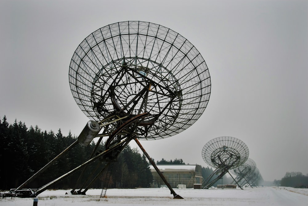a group of large satellite dishes