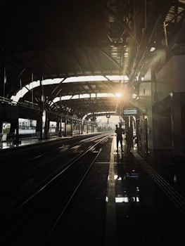 a person walking down a train platform