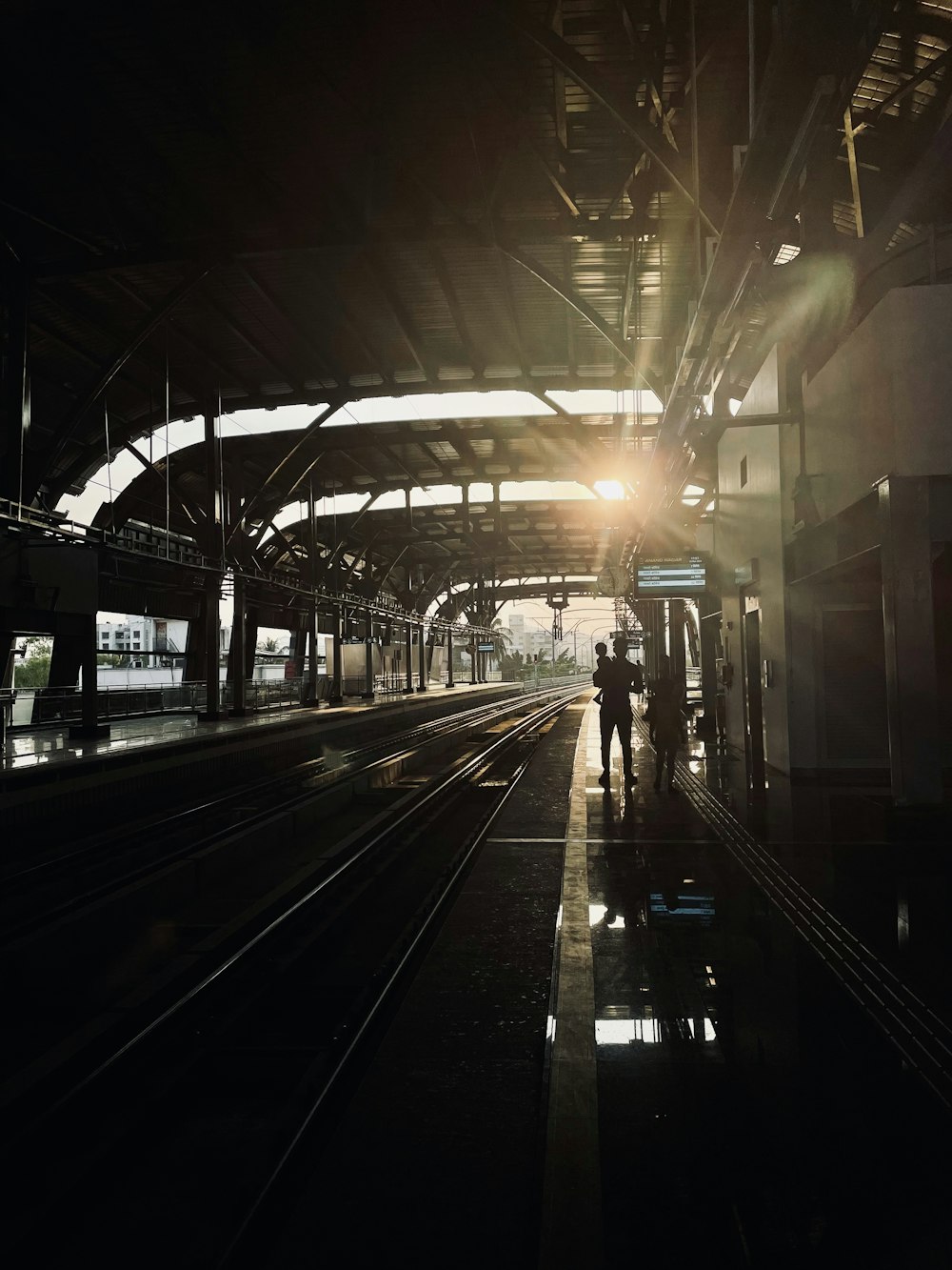 a person walking down a train platform