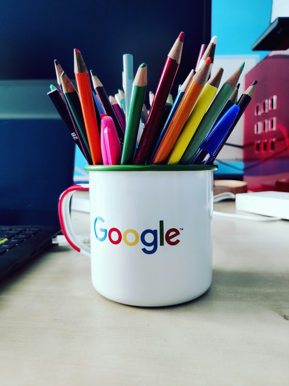 a cup of pens and pencils