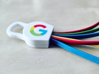 a white and blue cup with a logo on it