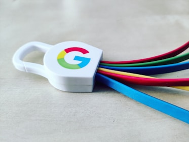 a white and blue cup with a logo on it