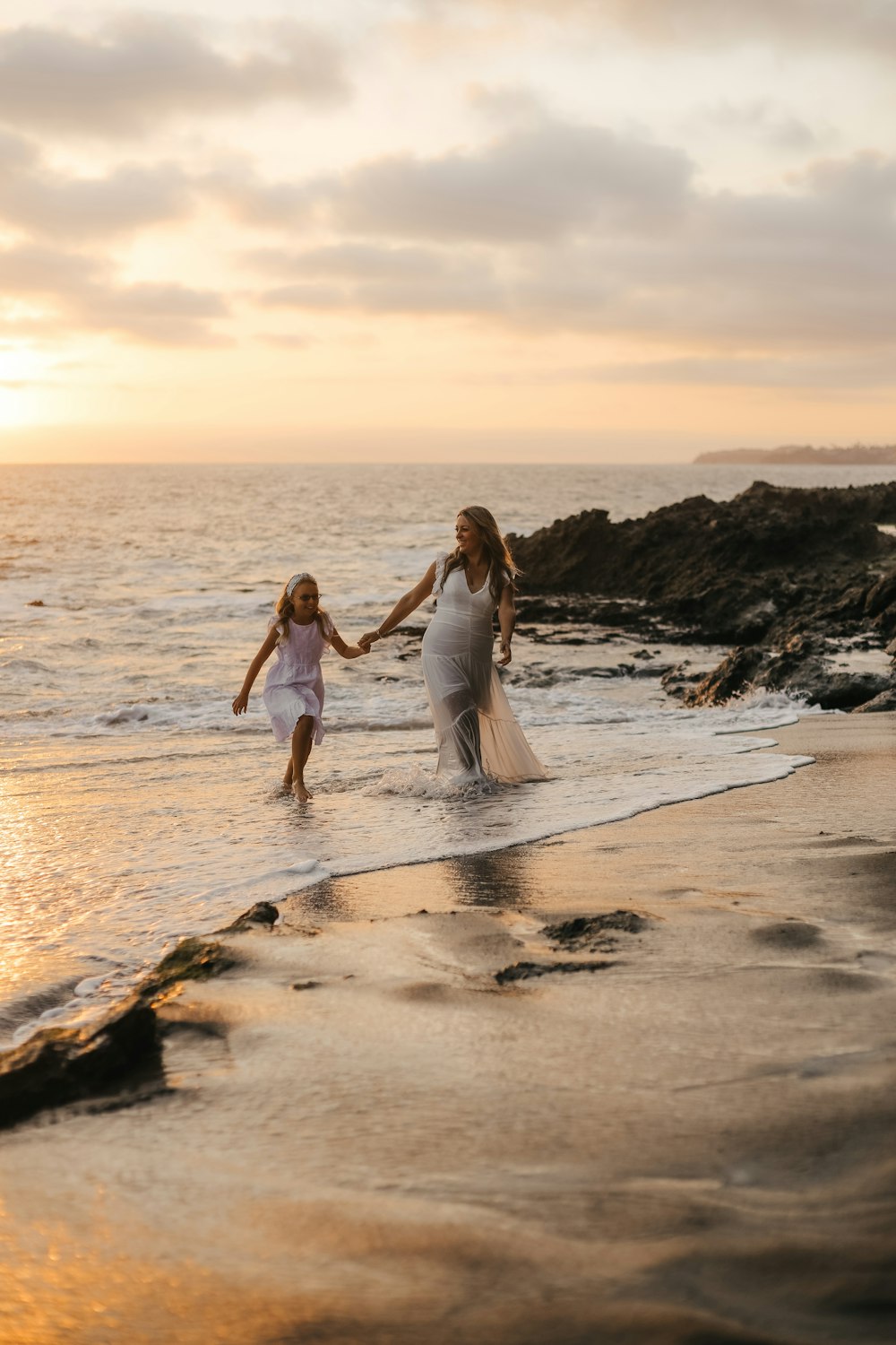 two women walking on a beach