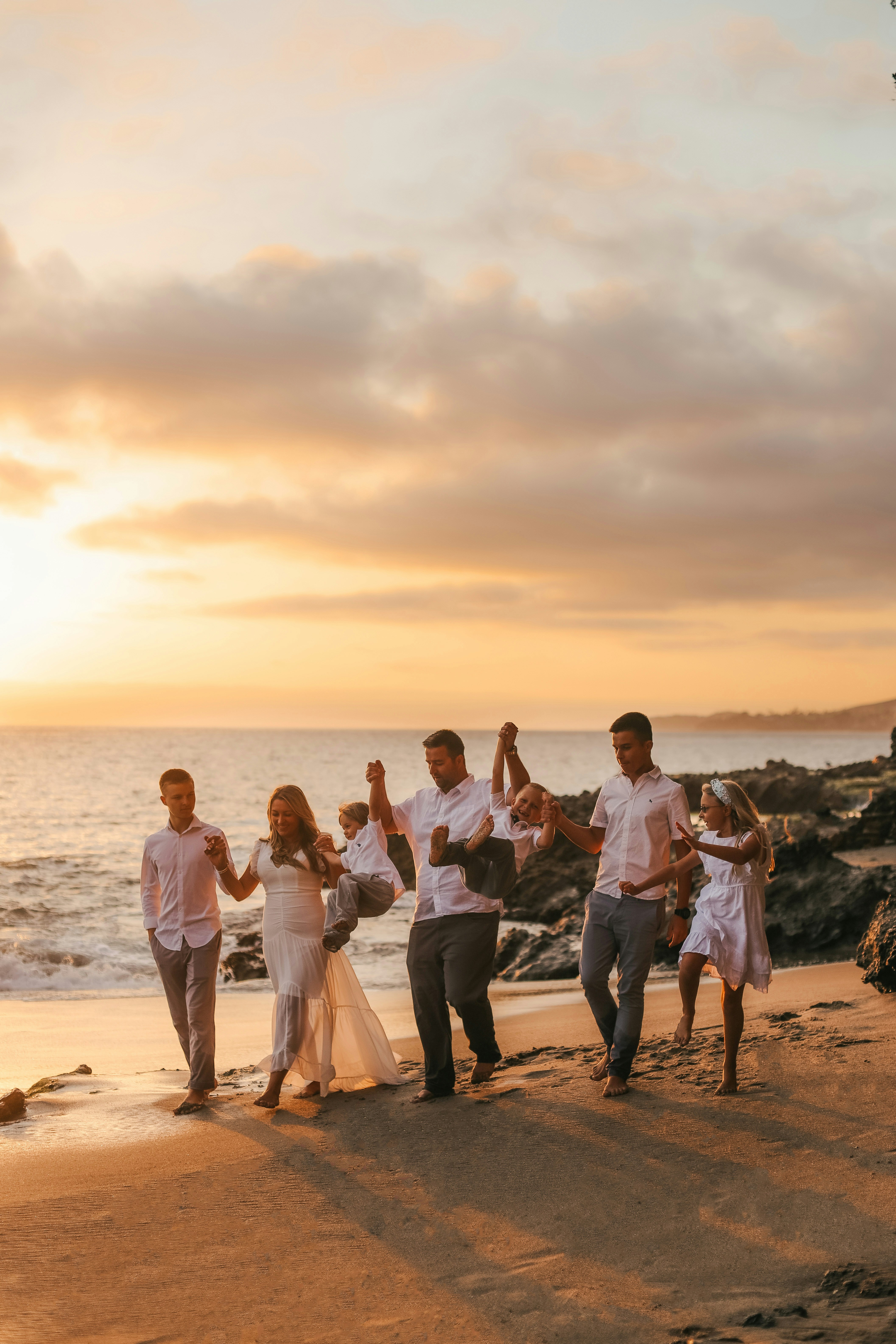 A group of people posing for a photo on a beach photo – Free Ca Image ...