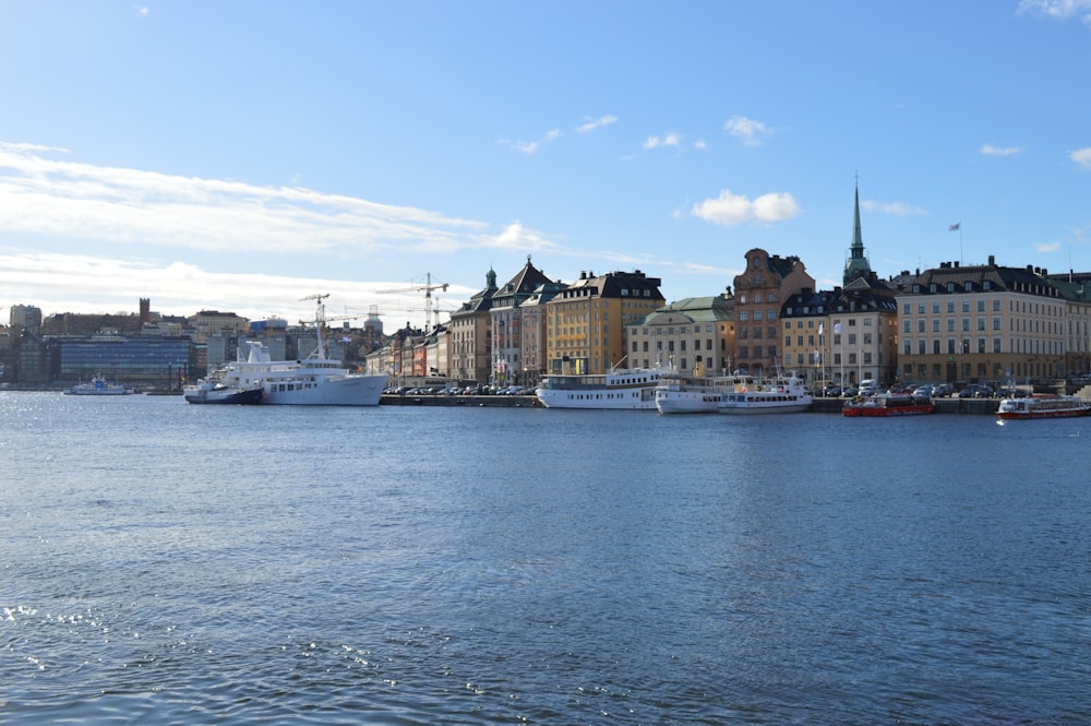 a body of water with boats in it and buildings around it