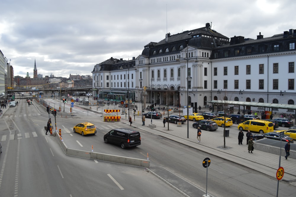 a busy street with cars and people