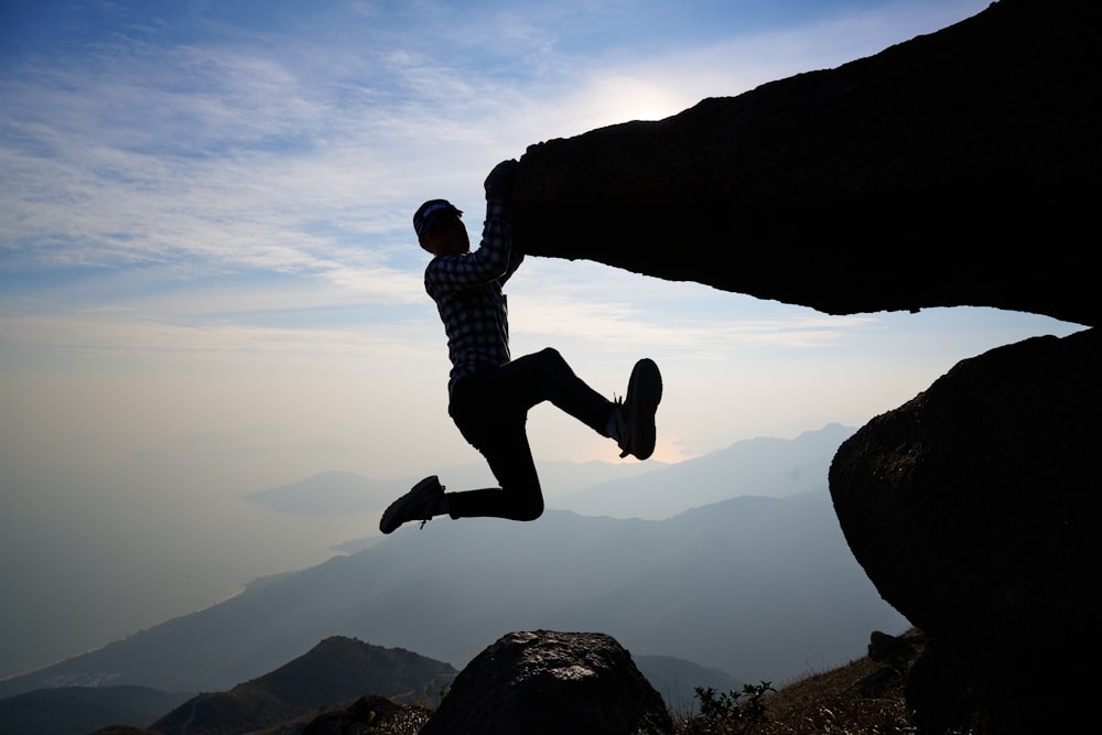 a person jumping off a cliff