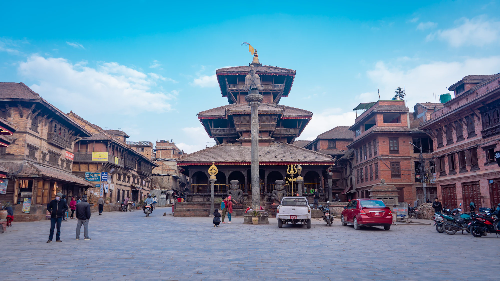 Ornate pagoda temple with a gilded statue in Bhaktapur Durbar Square, Kathmandu Valley