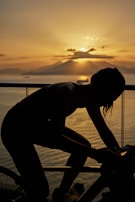 A scenic shot of a cyclist riding a Schnell bike along a peaceful Kangeyam street at sunset.