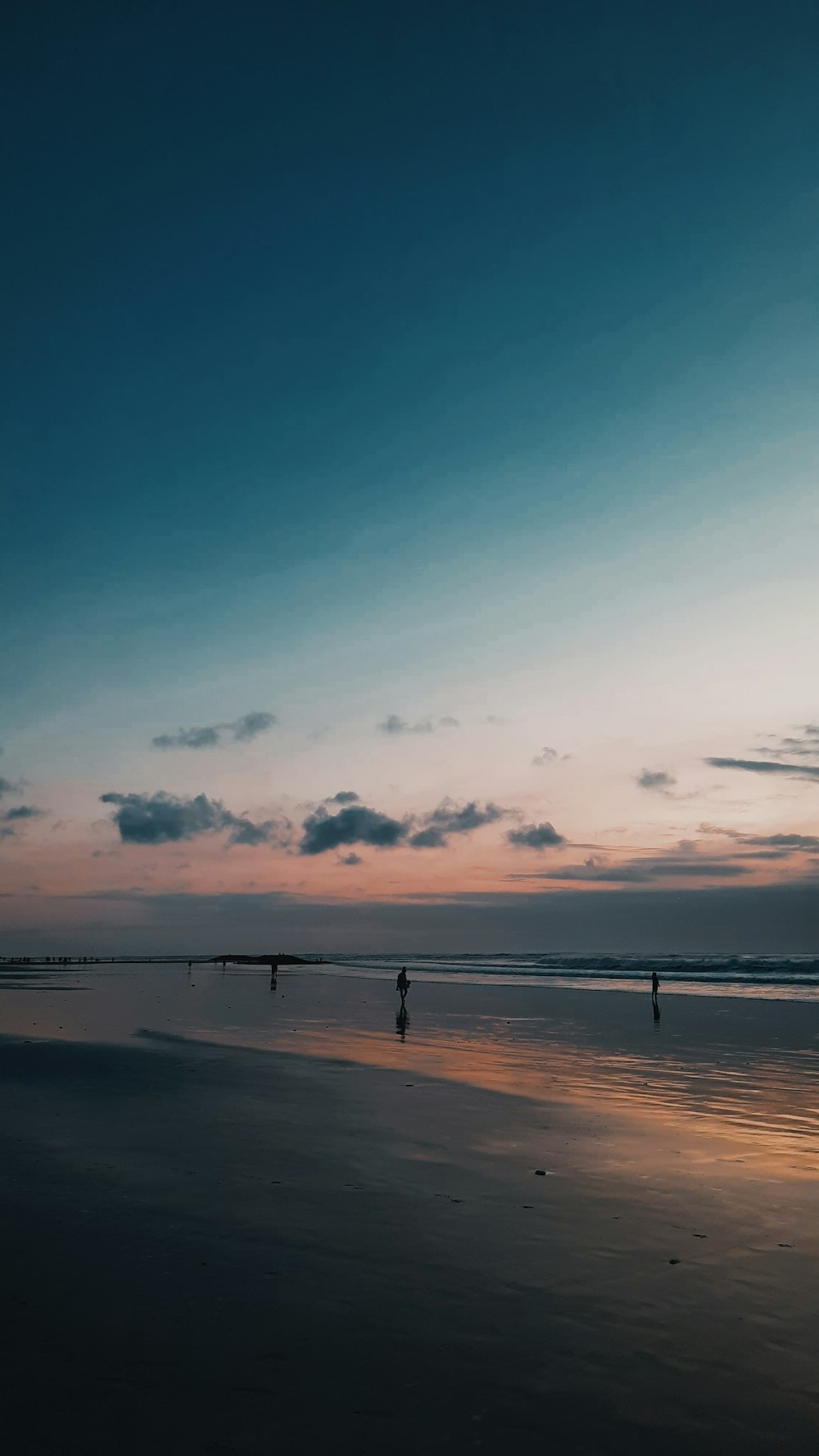 a couple people on a beach