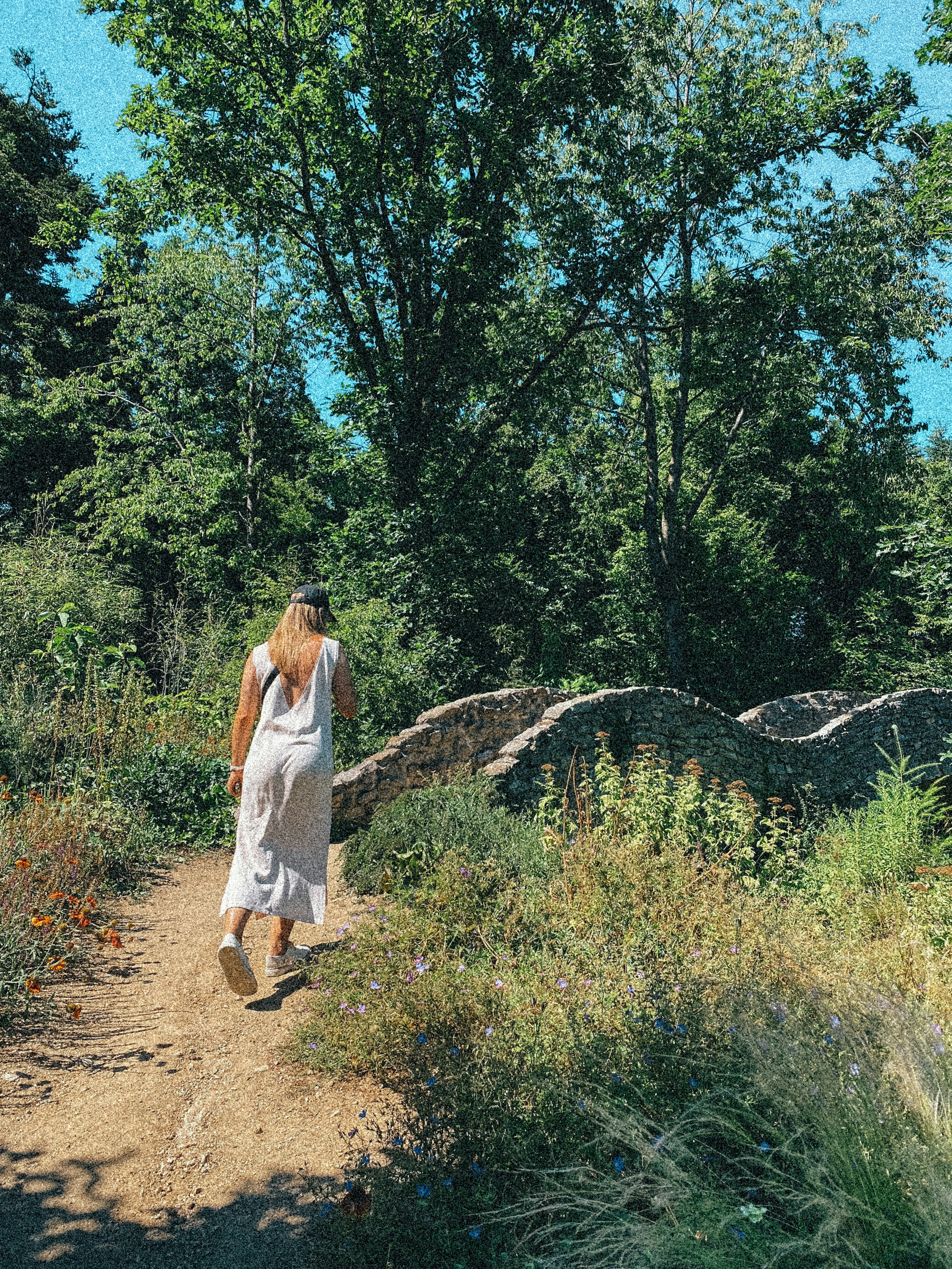 a person walking on a dirt path