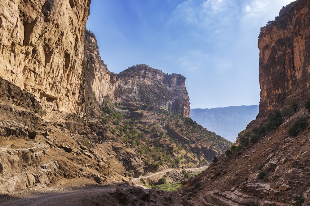 a rocky canyon with a road