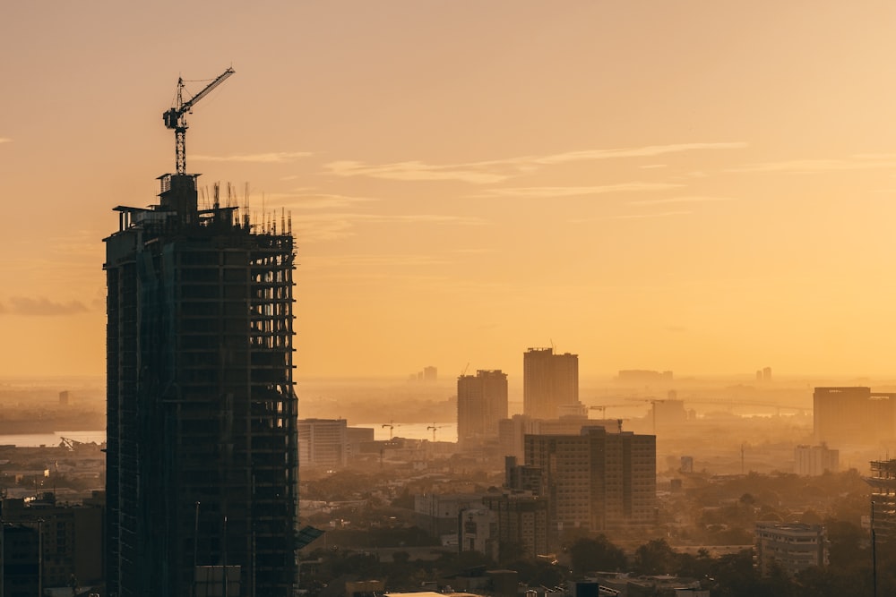 a city skyline with a crane
