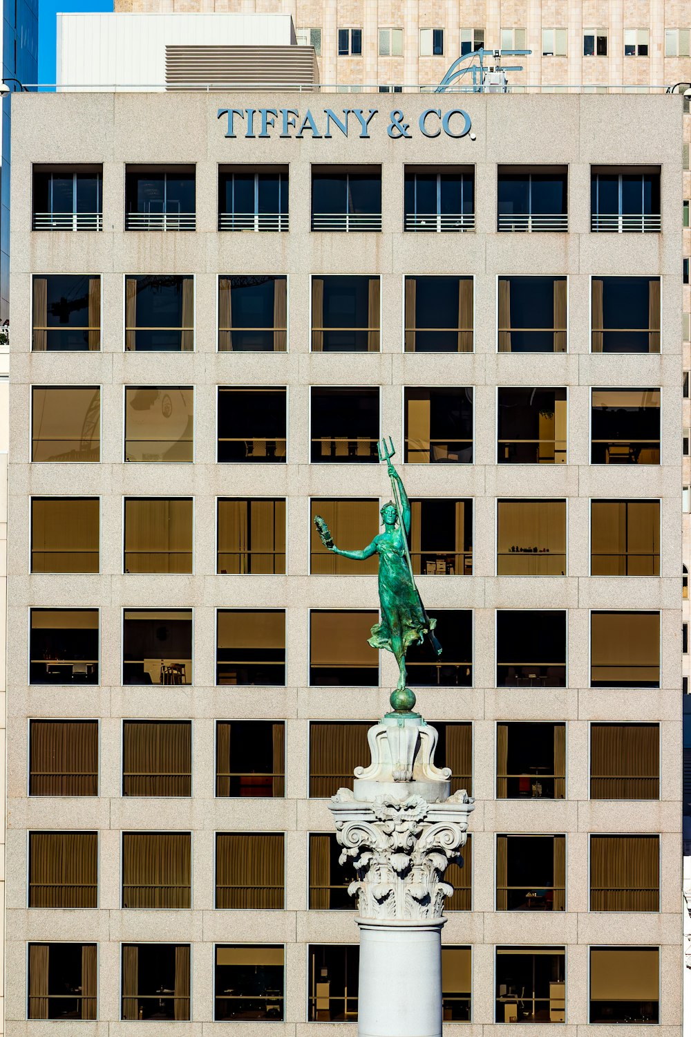 a statue in front of a building