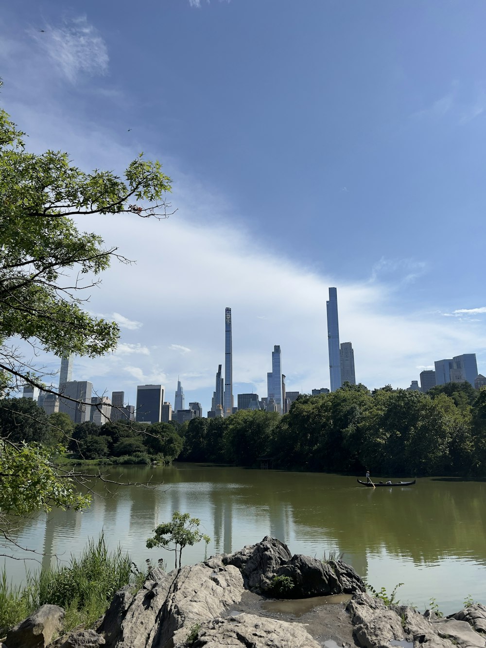 a body of water with a city in the background