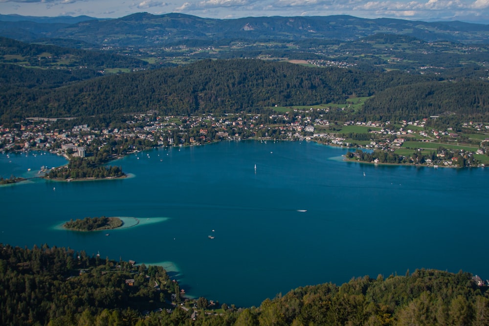 a body of water surrounded by trees and buildings