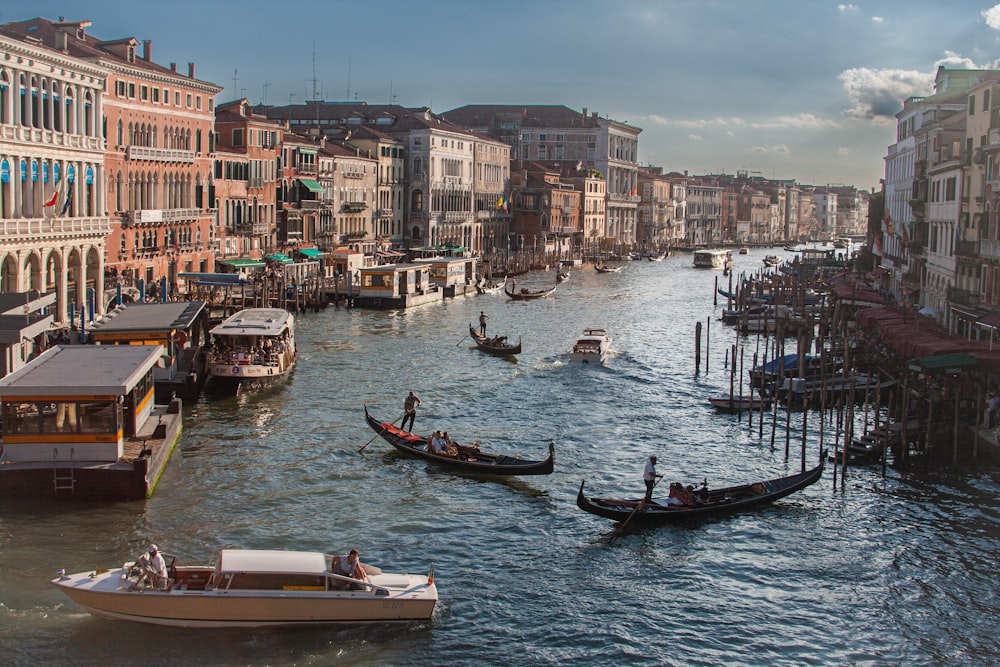 a group of boats in a river with Grand Canal in the background