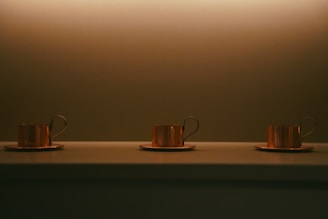 A collection of copper mugs filled with vibrant cocktails, ready to serve.