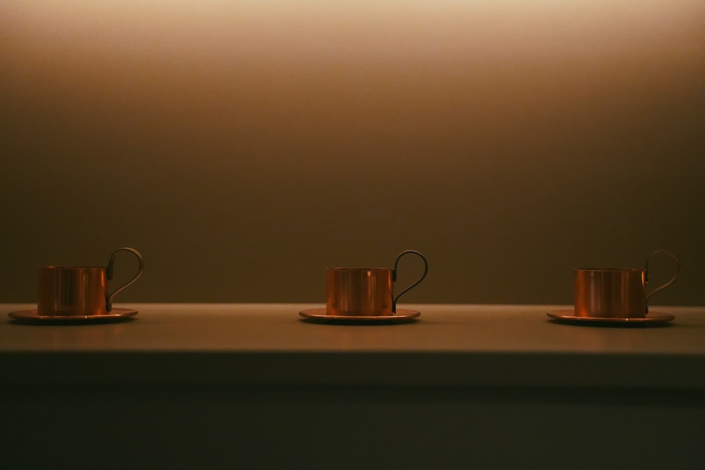a couple of tea cups on a table