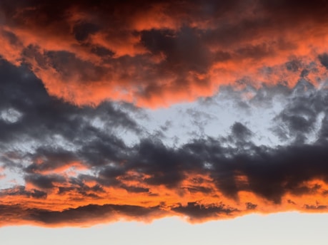 A dramatic sunset over a stormy horizon symbolizing the urgency of end times prophecy.