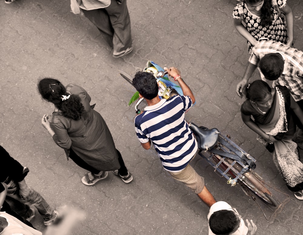 a group of people around a person holding a gun