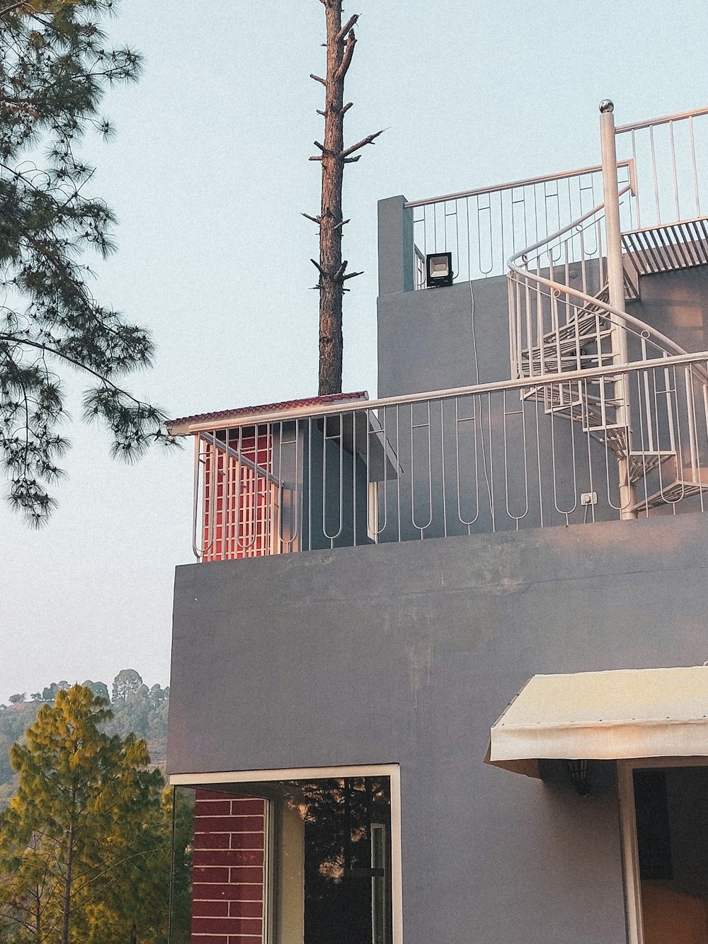 a house with a metal railing