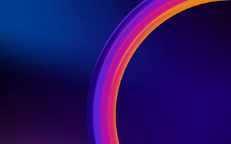 A vibrant radial typographic graphic in shades of blue, teal, and bronze centered on a deep purple background with a semi-transparent gray overlay.