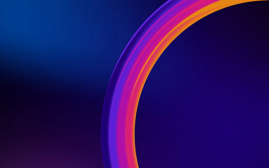 A vibrant radial typographic graphic in shades of blue, teal, and bronze centered on a deep purple background with a semi-transparent gray overlay.