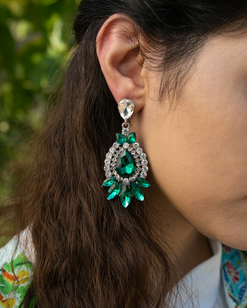 a woman with a diamond ring on her ear