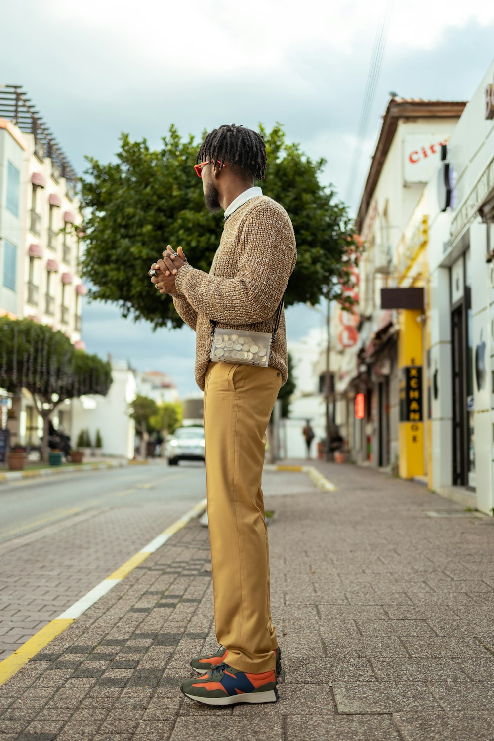 a person standing in the middle of a street