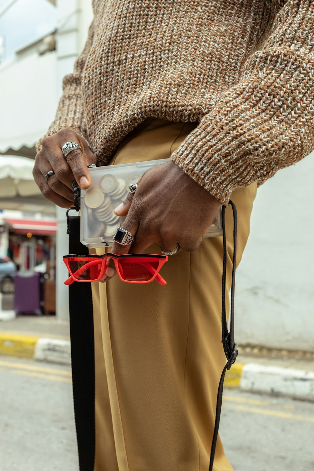 a person wearing a fur coat and holding a bottle