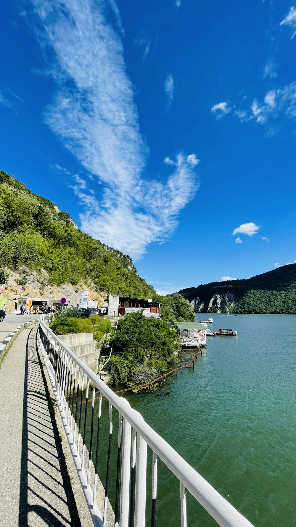 a body of water with a bridge and buildings along it