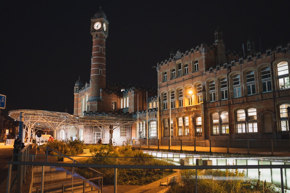 a clock tower next to a building