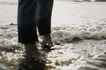 a person's feet in the water