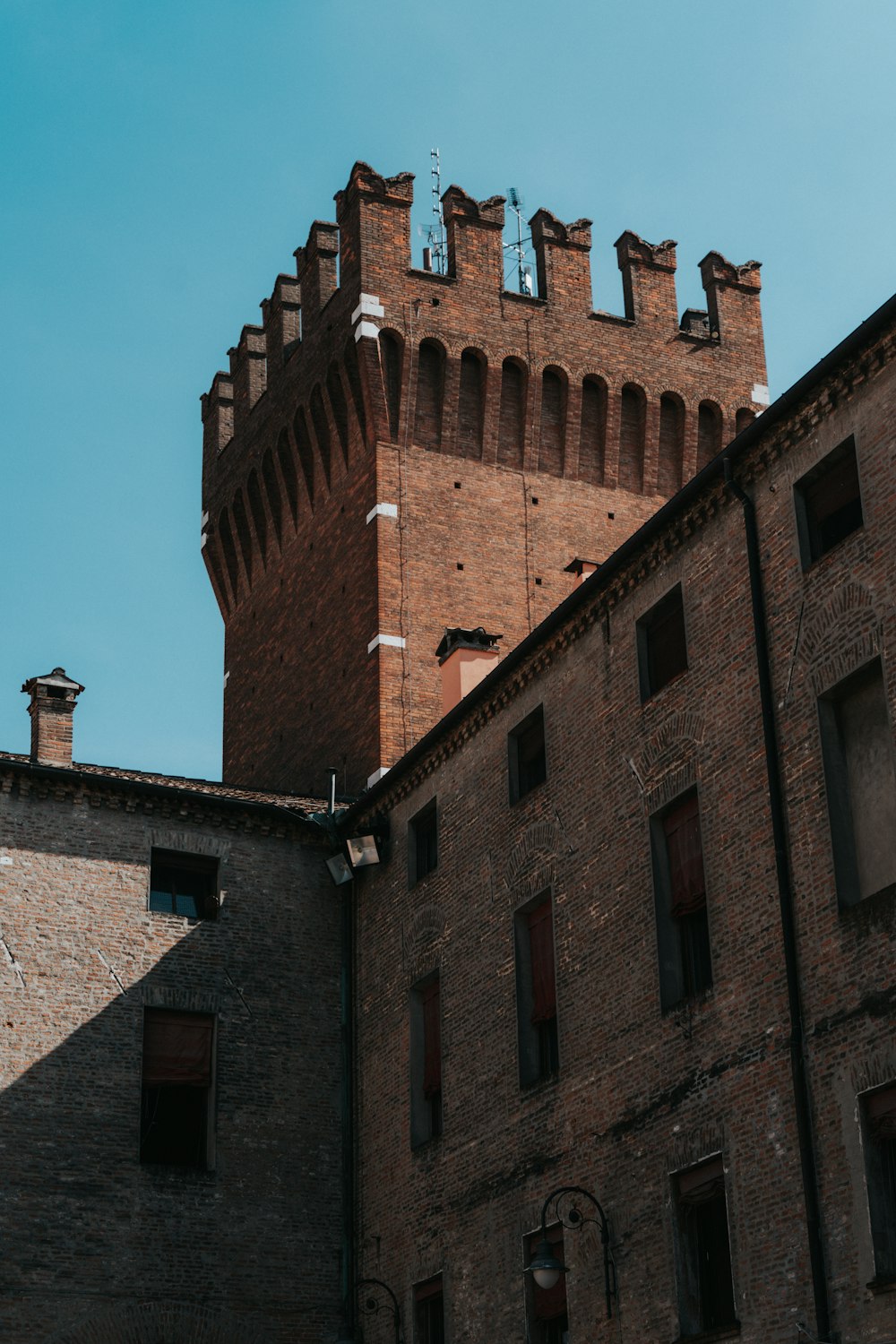 a brick building with a blue sky