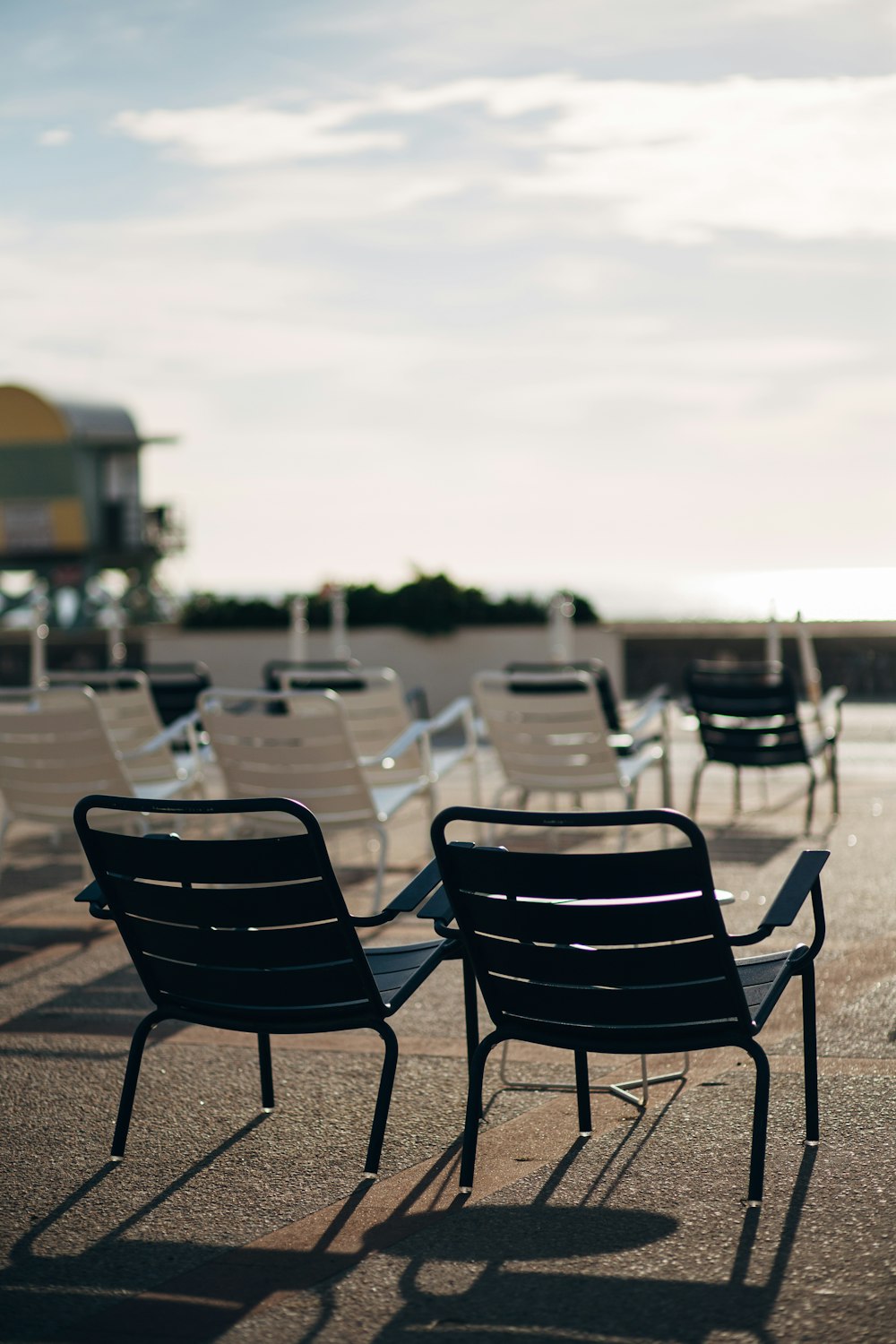 a group of tables and chairs on a deck