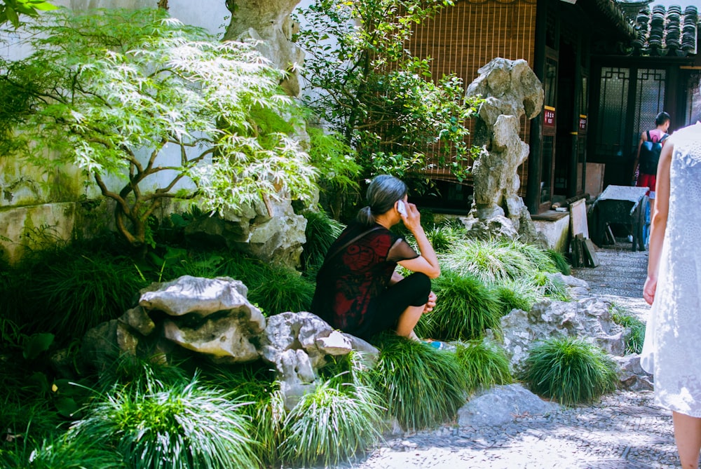 a person sitting in a garden