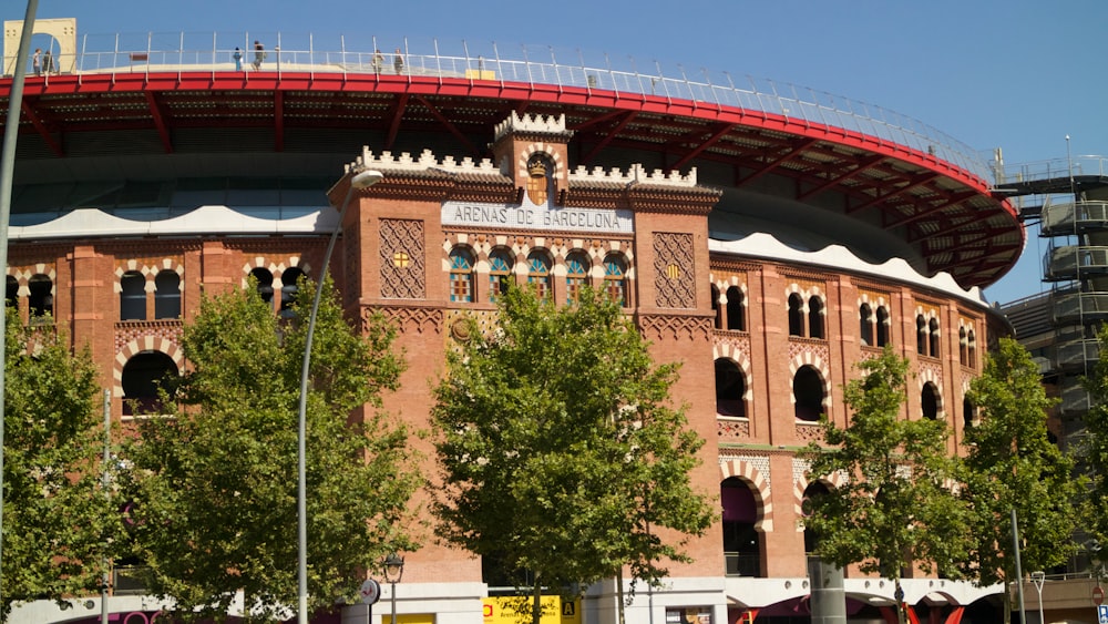 a large red building with a bridge