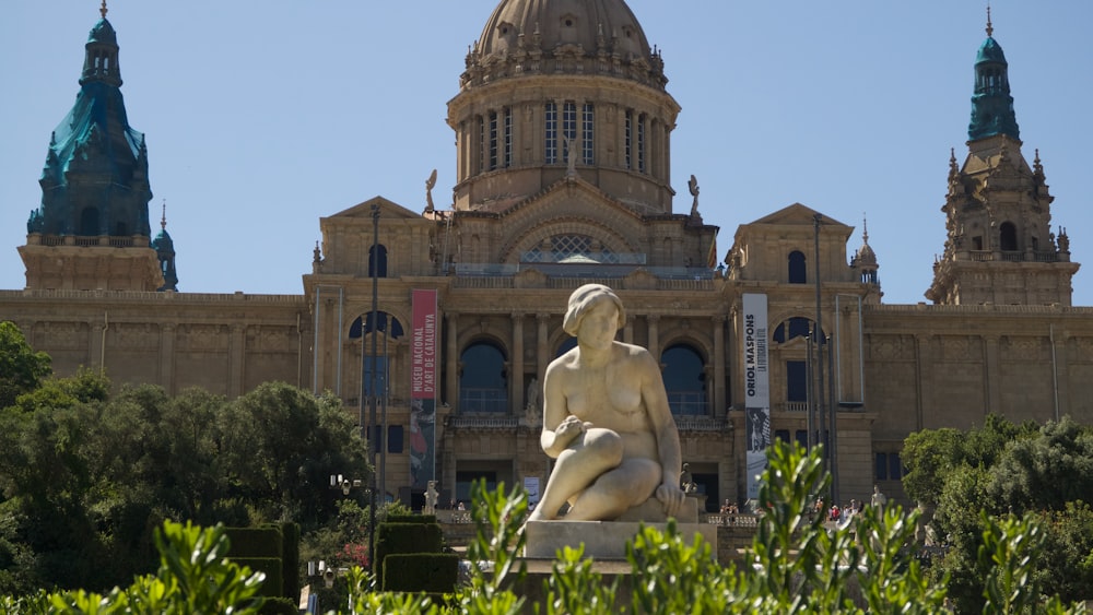 a statue in front of a building