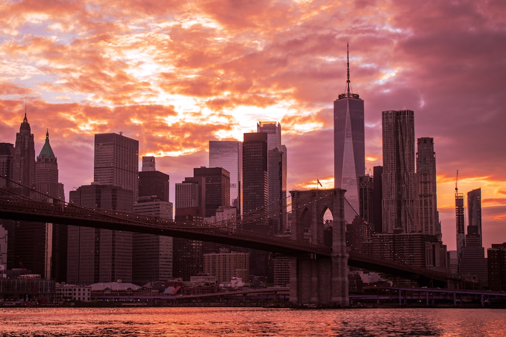 a city skyline with a bridge