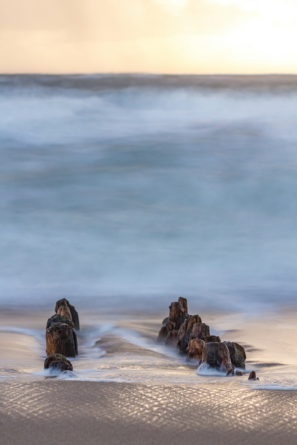 a group of rocks on a beach