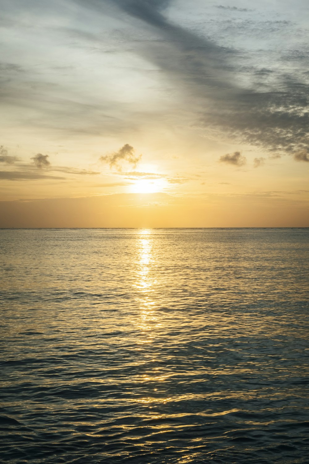 a body of water with a sunset