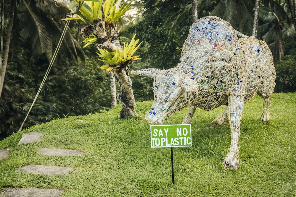 a statue of a horse with flowers on its head