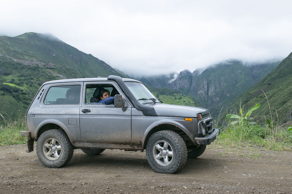 a person driving a jeep