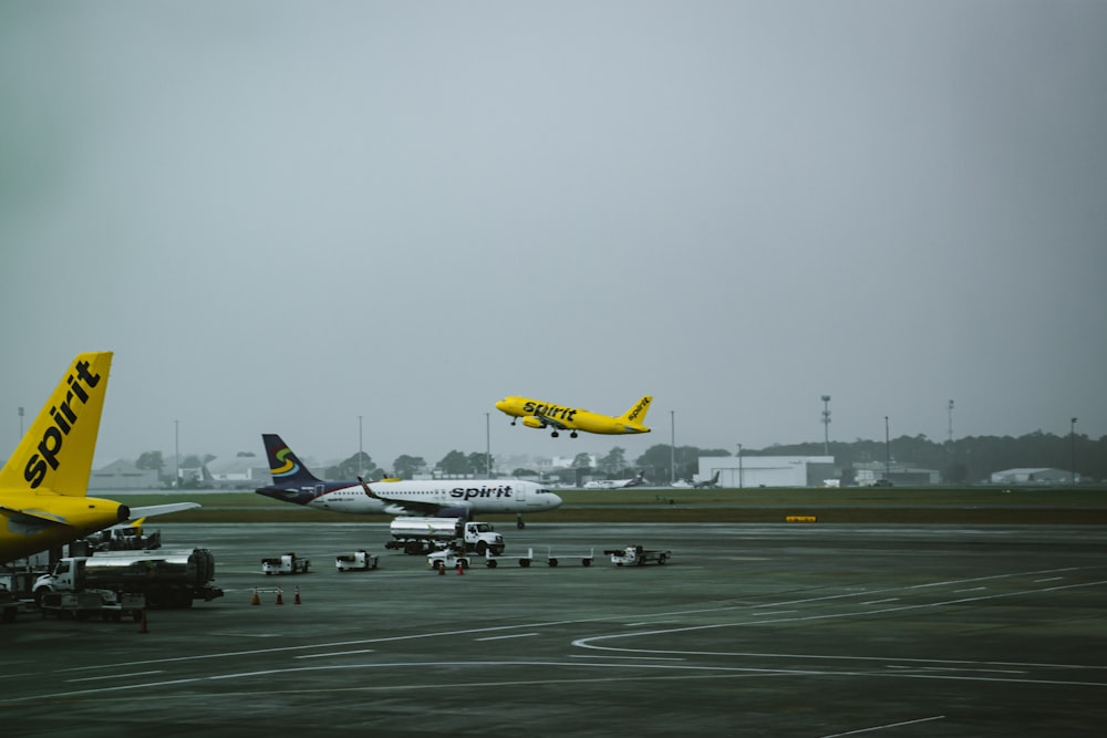 a group of airplanes at an airport