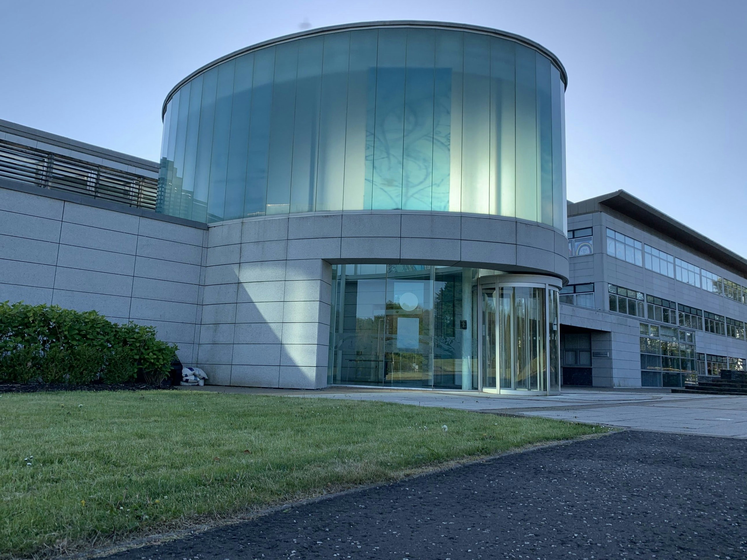 Modern office building exterior in Gandhinagar with glass facade and professional entrance