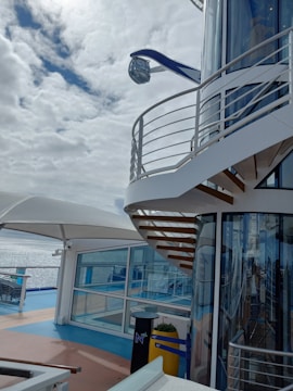 Fiber optic cables and satellite dishes on a cruise ship deck.