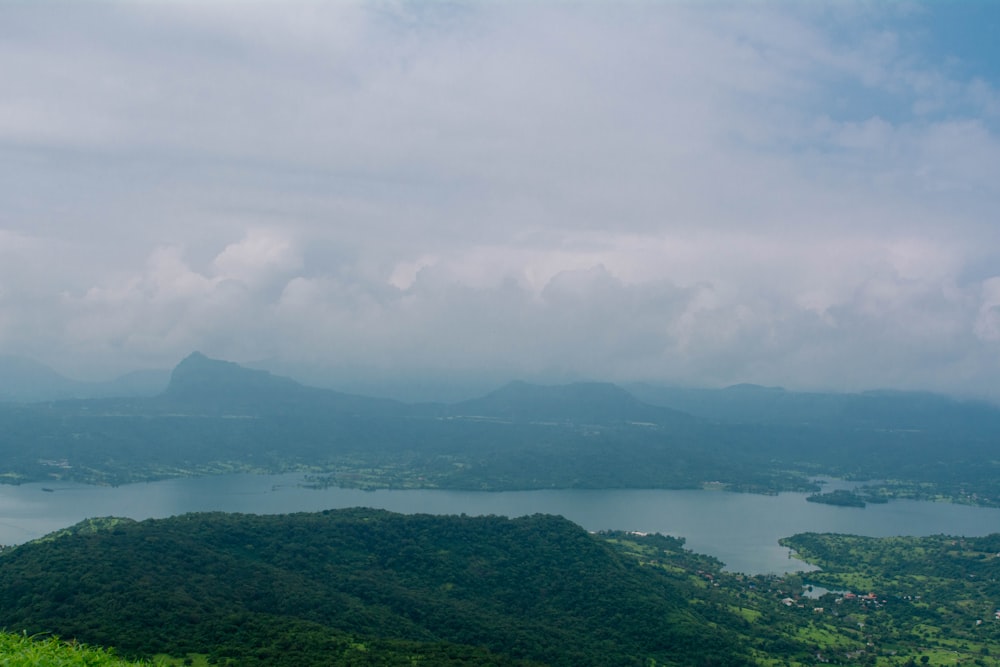 a body of water surrounded by hills