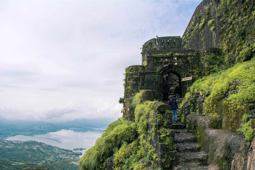 a person walking on a stone bridge