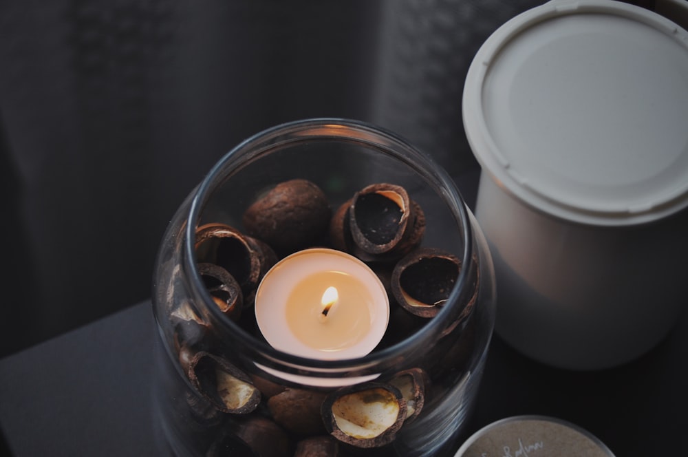 a candle in a glass jar